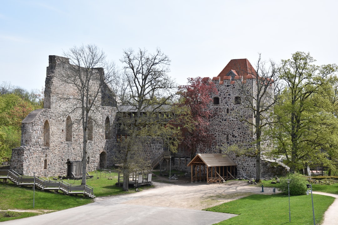 an old stone castle with a walkway leading to it